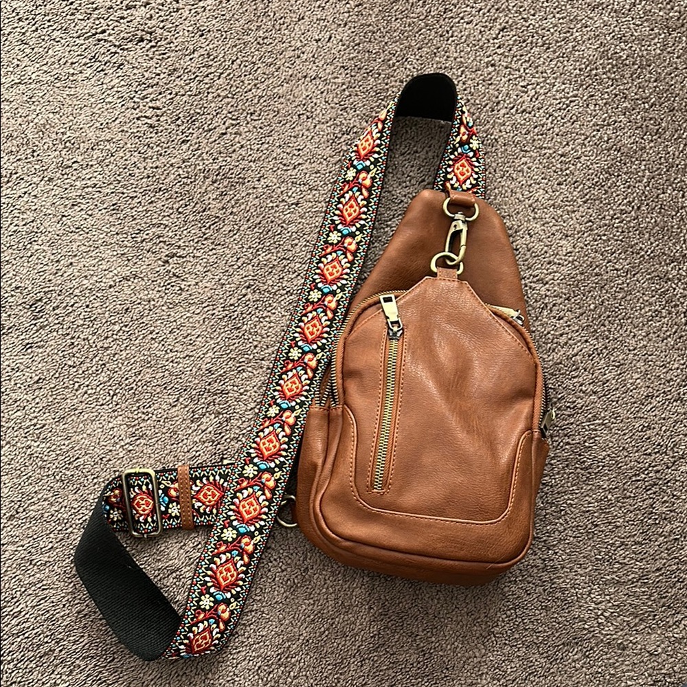 Chic Brown Crossbody Bag with Vibrant Strap
